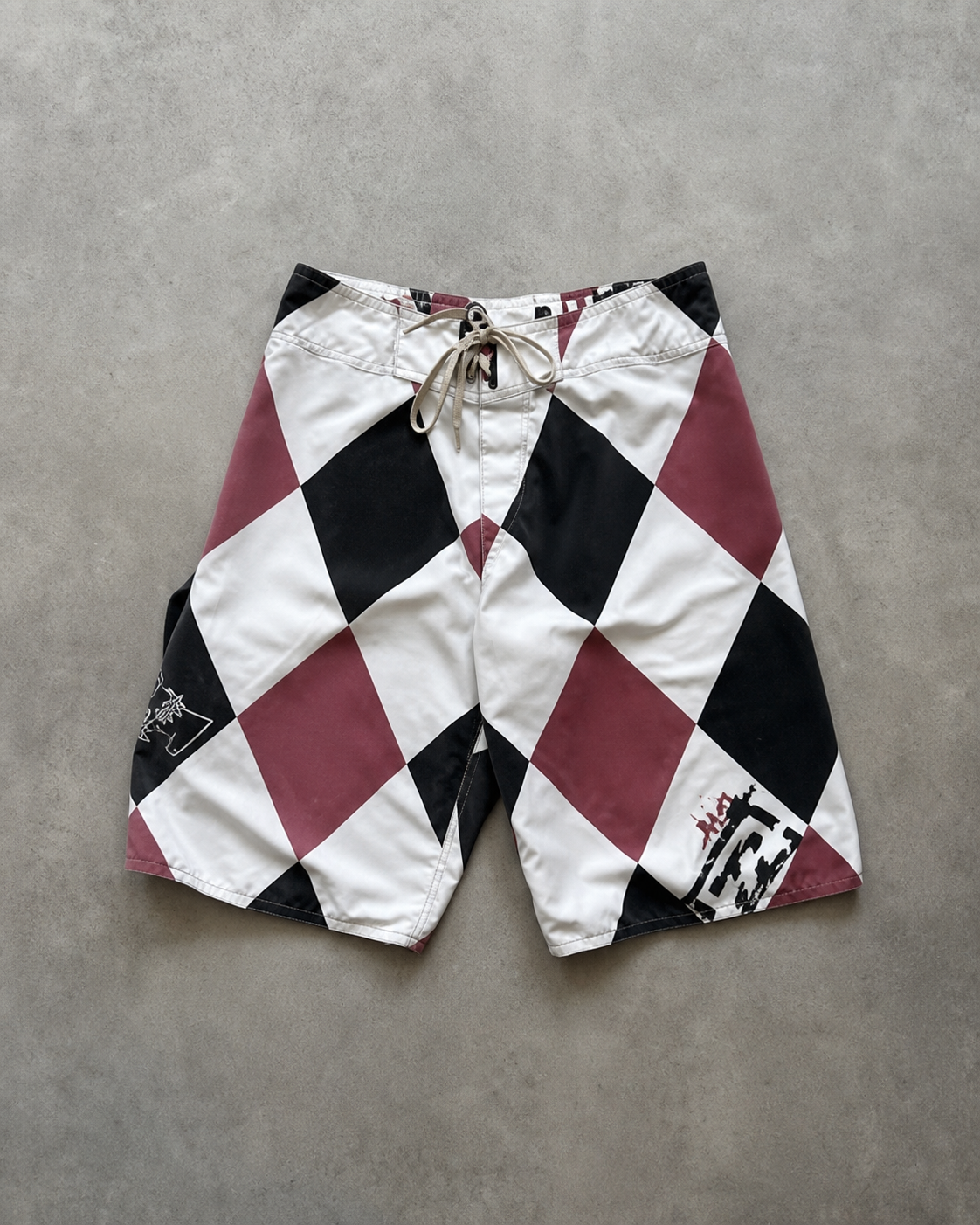 Dusty Red Argyle Andy Irons-era boardshort reference in dusty red / black / white