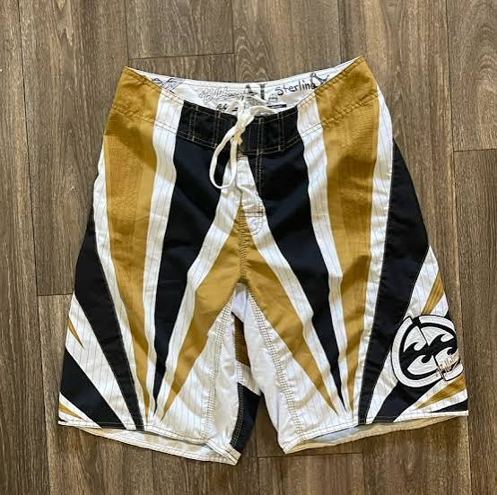 Gold Sun Andy Irons-era boardshort reference in gold / black / white