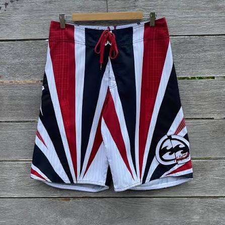 Patriot Sun Andy Irons-era boardshort reference in red / white / black