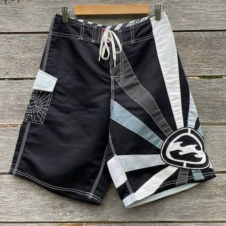 Vintage black, silver, and white Andy Irons Rising Sun boardshort reference