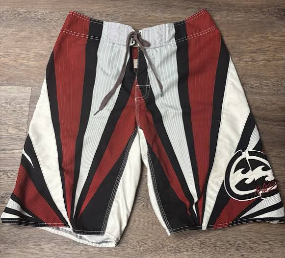 Crimson Burst Andy Irons-era boardshort reference in red / black / white